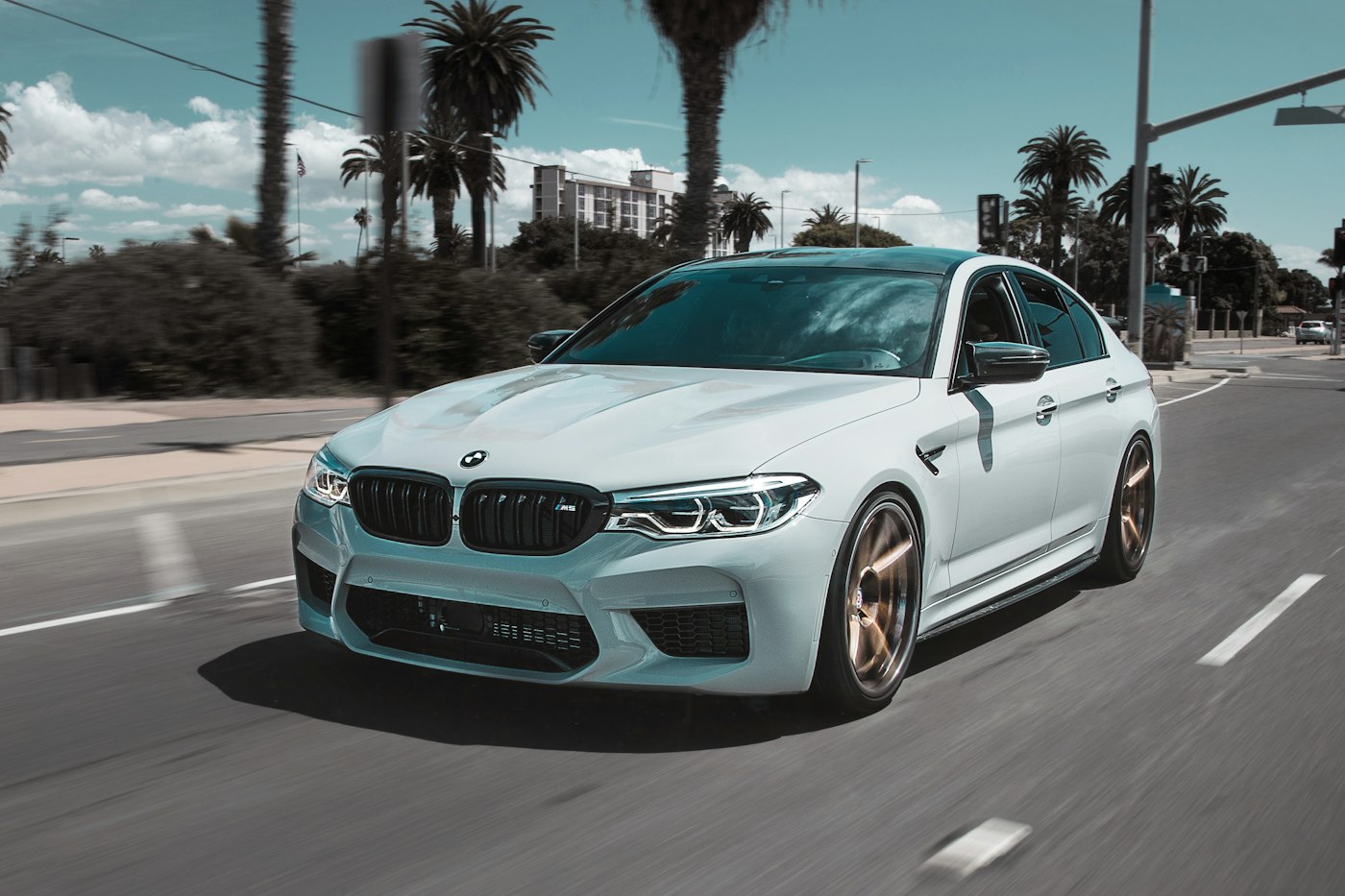 Blue sedan photographed from a low front angle