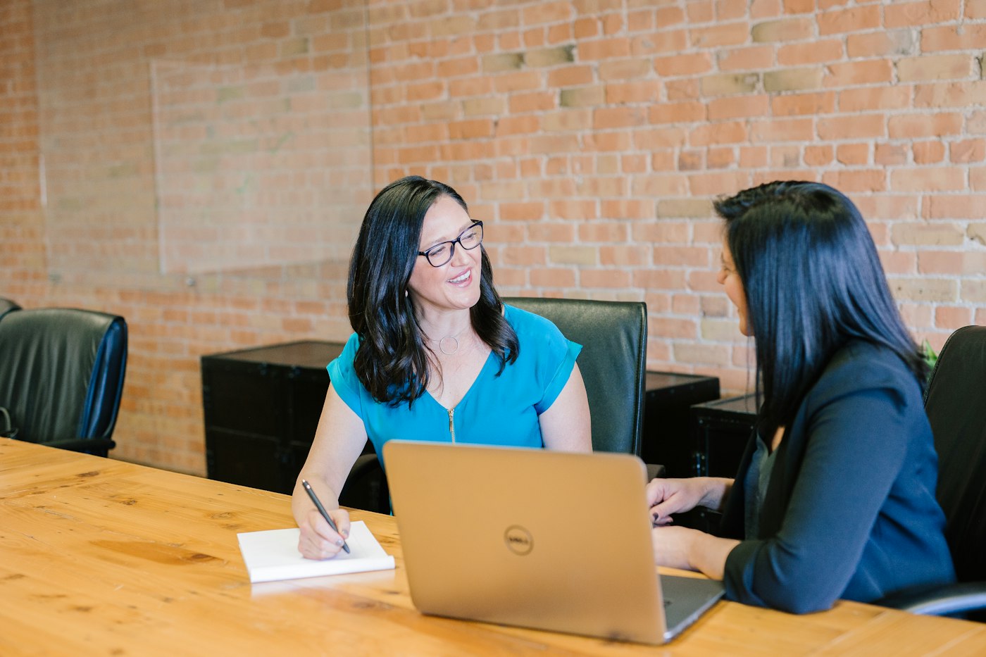 Member speaking with an advisor across a table